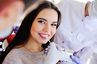 a patient smiling during the veneer process