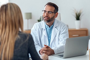 dentist talking to patient about additional financing options 