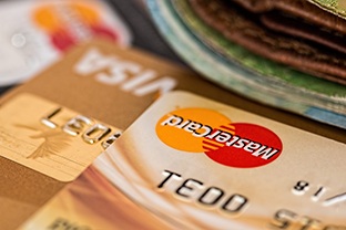 Credit cards and wallet on wooden table