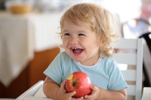 young child with apple