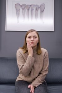 Woman with toothache at dentist